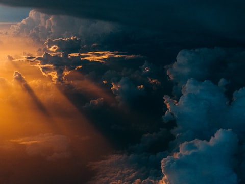 Sunlight breaking through clouds, illustrating the science brief